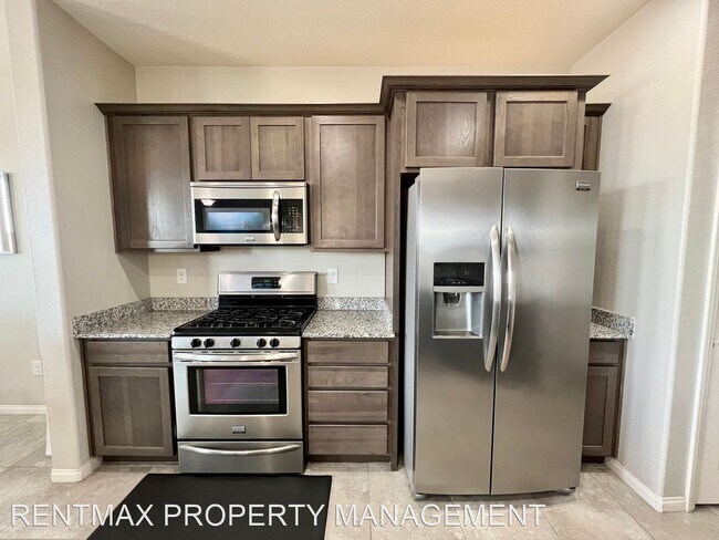 Building Photo - 4 br, 2.5 bath House - 8915 DRUMMER BAY AVE