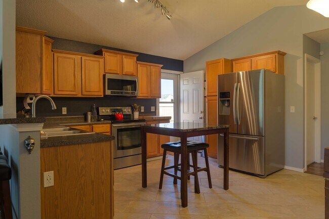 Kitchen with north facing door to the yard - 700 NE Fenway Ave