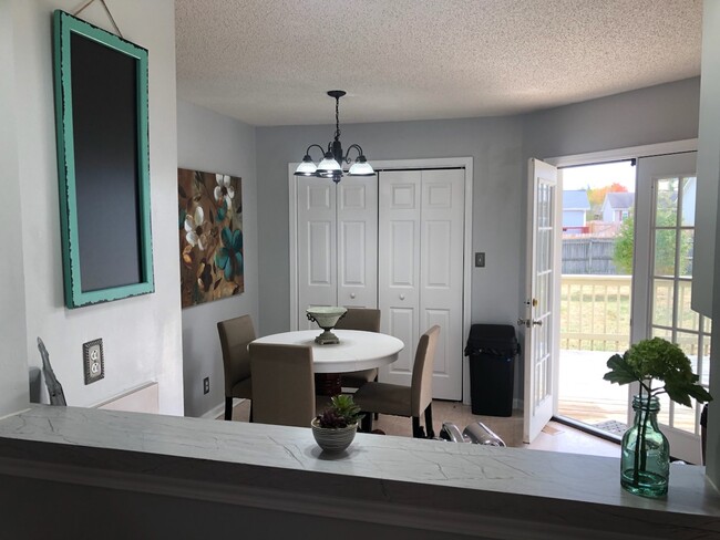 Dining area with view of deck and back yard - 324 Atlantic Ave