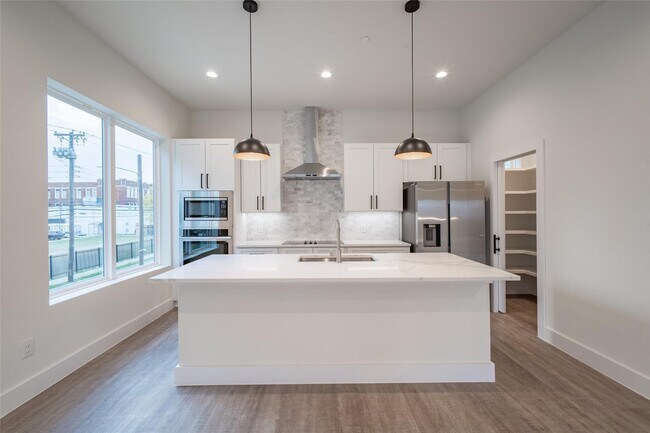 Building Photo - Modern 4-Level Corner Condo with Rooftop Deck & Downtown Views – 2BR/2.5BA + Flex Spaces, 2-Car G...