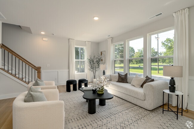4BR, 3.5BA - 2,219SF - Living Room - Towns at Rocky River