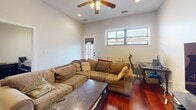 Located in Chicago's vibrant Lakeview neighborhood, this 1-bedroom, 1-bathroom unit on N Clark Street offers a well-designed, single-floor layout that maximizes functionality and comfort. Rich cherry hardwood floors flow throughout the main living areas, creating a warm and cohesive aesthetic.

The open-concept kitchen, dining, and living area forms the heart of the home. The kitchen is appointed with warm-toned wood cabinetry, granite countertops, stainless steel appliances including a refrigerator and range, and pendant lighting that adds a polished touch. A breakfast bar provides a seamless transition into the dining area, where a classic wood dining table and louvered closet doors add character. The living room benefits from a ceiling fan, recessed lighting, and windows that invite natural light and neighborhood views.

The bedroom is a quiet retreat with a built-in closet and neutral tones. The bathroom features a granite-topped vanity with wood cabinetry, tile flooring, and a shower-tub combination. Four closets throughout the unit provide generous storage. A hallway connects the spaces efficiently.

A standout feature is the spacious private outdoor deck with exposed brick, metal railings, and elevated neighborhood views — ideal for outdoor relaxation. The unit also includes a dedicated dining area with additional closet storage.