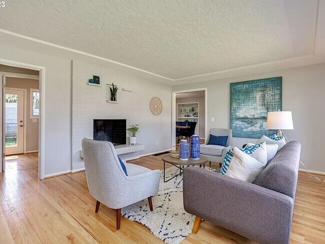 Building Photo - Stylishly Updated Mid-Century Gem on a Qui...