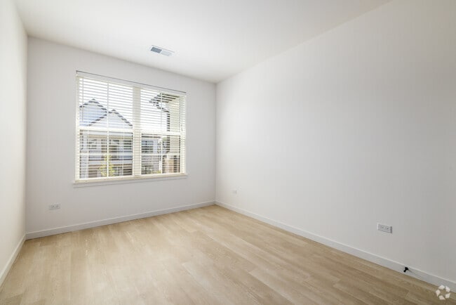 Primary Bedroom - The Belvedere Apartments