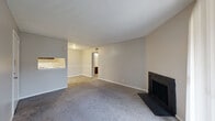 Located at 2102 E 51st St S in Tulsa, Oklahoma, this one-bedroom, one-bathroom unit offers a practical and comfortable single-floor layout. The open-concept living, dining, and kitchen area serves as the heart of the home, with plush carpeting underfoot in the living space and a classic wood-burning fireplace as a standout focal point. A sliding glass door with vertical blinds floods the living area with natural light and provides direct access to a private balcony. The galley-style kitchen is efficiently designed with dark cabinetry, light countertops, a full suite of appliances, and light wood-look flooring that extends through the dining area. A dedicated pantry adds valuable storage. The bedroom is a comfortable size, featuring carpet flooring, a window for natural light, and access to multiple closets for generous storage. The bathroom is well-appointed with a single-sink vanity featuring dark cabinetry, a full tub/shower combination, and matching light wood-look flooring. A hallway connects the rooms cohesively, and textured ceilings are consistent throughout. This unit offers a functional, move-in-ready layout suited for everyday living.