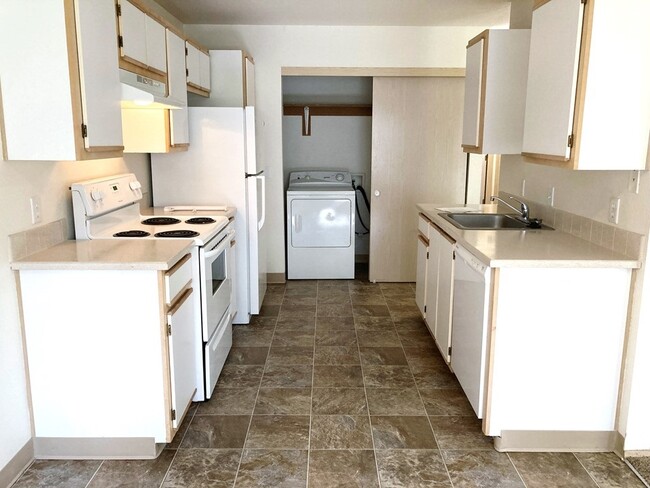 Kitchen w/Laundry - Cedar Grove Apartments