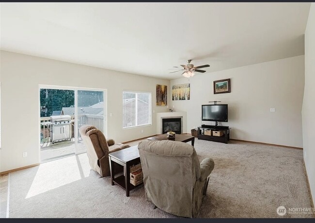 Living room opens to deck for BBQ or sitting area - 106 Goldenrod St