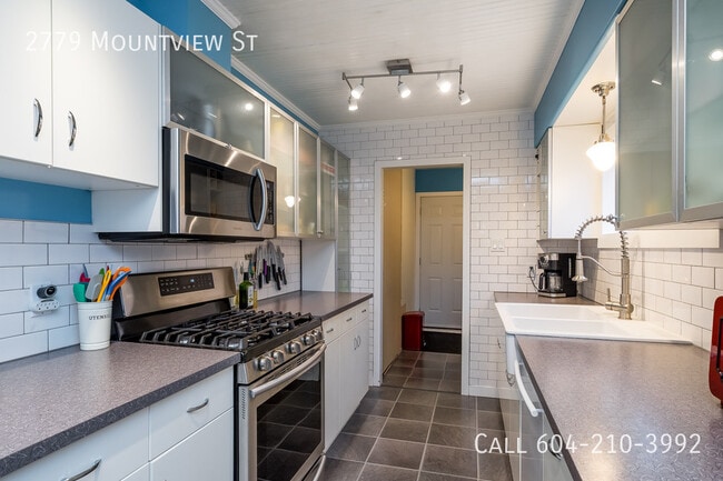 Photo du bâtiment - Charming Rancher With Basement