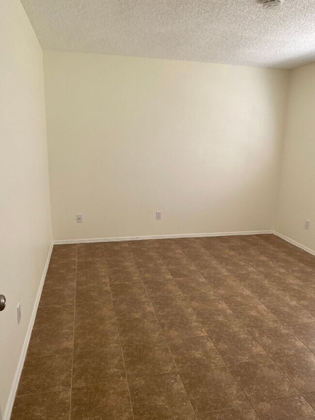 Building Photo - 2/2/1 home with a spacious fenced backyard...