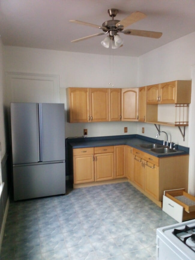 New flooring in kitchen and bathroom coming in July. - 505 Marcellus St
