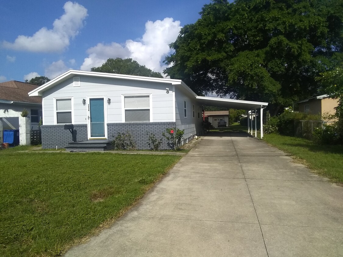 Front with the long drive way and carport - 3634 37th St N