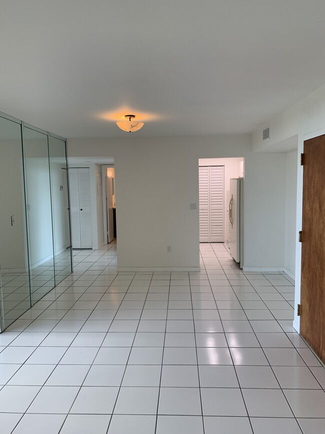 Looking towards kitchen, bedrooms 2 & 3 and 2d bathroom from entrance to master bedroom - 11750 SW 18th St