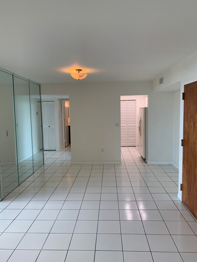 Looking towards kitchen, bedrooms 2 & 3 and 2d bathroom from entrance to master bedroom - 11750 SW 18th St