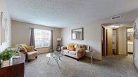 Located at 5418 Arbrook in Columbus, Ohio, this one-bedroom, one-bathroom unit offers a thoughtfully organized single-floor layout. The open-concept living, dining, and kitchen area forms the heart of the home, providing a comfortable and connected space for everyday living. The living area features soft carpeting, a textured ceiling, and a large window that invites natural light and outdoor views, creating a bright and welcoming atmosphere.

The kitchen is positioned adjacent to the dining area, offering convenient access and a functional flow. A dedicated hallway connects the main living space to the private areas of the home. The bedroom is a well-proportioned retreat, featuring plush carpeting, multiple windows with natural light, and a textured ceiling. It is complemented by generous closet storage, with three closets throughout the unit providing ample organization options.

The bathroom includes a full tub-shower combination with clean white surroundings and wood-style flooring, adding a touch of warmth. The unit also benefits from a dedicated laundry area and a utility room, enhancing everyday convenience. Neutral tones and warm finishes are carried throughout, lending the space a cohesive and inviting character.