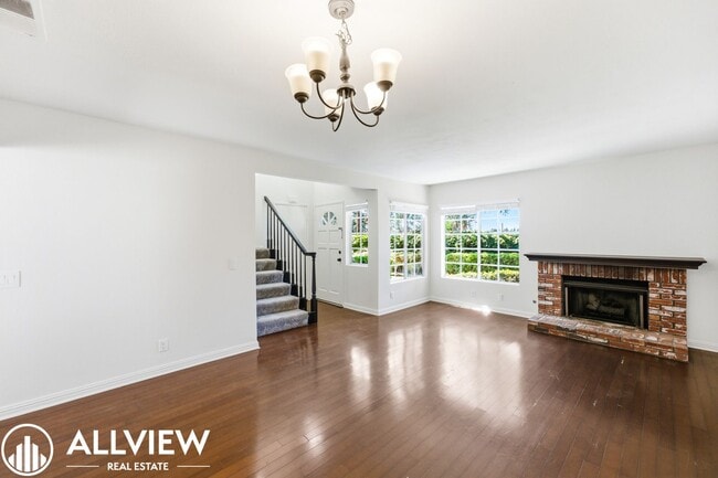 Building Photo - Fully Renovated 2 Bed Townhome with Private Patio, 2-Car Garage & Community Pool