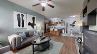 Located at 9060 Magnolia Ln in West Chester, OH, this 2-bedroom, 2-bathroom home offers a well-designed single-floor layout that maximizes functionality and comfort. The open-concept living and kitchen area serves as the heart of the home, featuring rich hardwood-style flooring, a ceiling fan, and large windows that invite abundant natural light. The living room offers a welcoming atmosphere with a neutral color palette accented by a soft teal feature wall.

The kitchen is a standout space, equipped with stainless steel appliances including a refrigerator, range, microwave, and dishwasher. Warm wood cabinetry, granite countertops, a subway tile backsplash, a built-in wine rack, and a peninsula with bar seating round out the stylish and practical design. Pendant and track lighting add a modern touch overhead.

Both bedrooms are carpeted and filled with natural light from large windows with blinds. The primary bedroom is a comfortable retreat with a ceiling fan and generous closet space. The bathrooms feature wood vanities topped with granite countertops and tub-shower combinations.

A dedicated in-unit laundry area with a full-size washer and dryer adds everyday convenience. Two closets provide ample storage throughout the home.