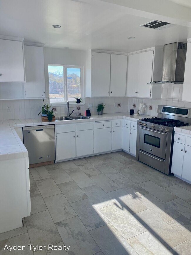 Building Photo - 4 br, 3 bath House - 1803 E Ave Q9