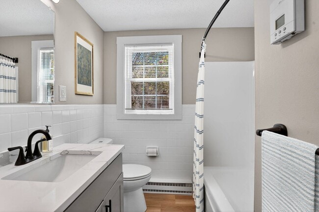 Welcome to Eagle Rock Apartments at Nashua, where modern comfort meets classic elegance. This stunning bathroom features contemporary fixtures and natural light, creating a refreshing retreat. Schedule your tour today and see your new home! - Eagle Rock Apartments at Nashua