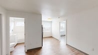 Located at 862 Asylum Ave in Hartford, Connecticut, this efficient one-bedroom, one-bathroom unit offers a well-organized layout across a single floor. The interior features consistent light wood-tone flooring throughout, crisp white walls, and clean white trim, creating a bright and cohesive aesthetic.

The open living and dining area flows naturally from the kitchen, which is equipped with dark wood cabinetry, a stainless steel refrigerator, and a gas range with an overhead exhaust fan. A large window with horizontal blinds allows natural light to fill the kitchen and adjacent dining space, with views of the neighboring brick architecture.

The bedroom is a quiet, well-proportioned room with a large window fitted with blinds, a baseboard heating unit, and access to a dedicated closet. A second closet is accessible from the hallway, providing additional storage.

The full bathroom features an all-white design with a single-sink vanity with cabinet storage, a combination bathtub and shower, and a small window for natural ventilation and light.

Throughout the unit, the clean finishes, ample natural light from multiple windows, and efficient use of space make this a practical and well-maintained residence in the Asylum Hill neighborhood of Hartford.