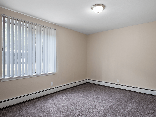 Bedroom with Overhead Light and Window - Shores of Roosevelt Park