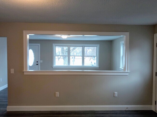 large opening between kitchen and living room - 9 Brentwood Cir