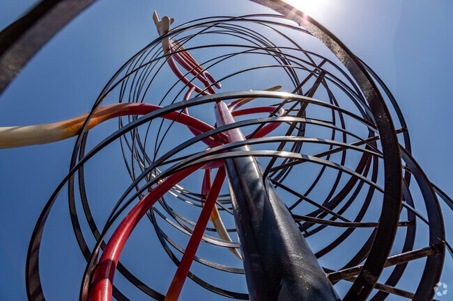 Amid a spiralling iron phoenix, strength is inferrred at Schrade Bluebonnet Park, Rowlett.