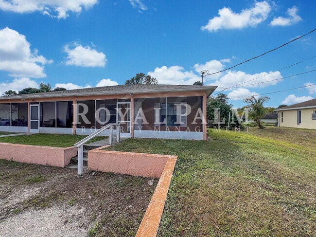 Building Photo - Make Yourself at Home — Charming 3-Bed, 2-Bath in Lehigh Acres. Your Duplex Dream Just Got Better!