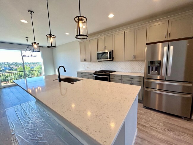 Building Photo - Impressive 4 Bedroom Townhome Nestled in M...
