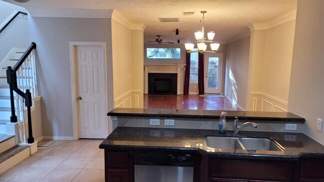View of the open concept first floor. The kitchen leads to the dining and living area. - 1622 Cohn St
