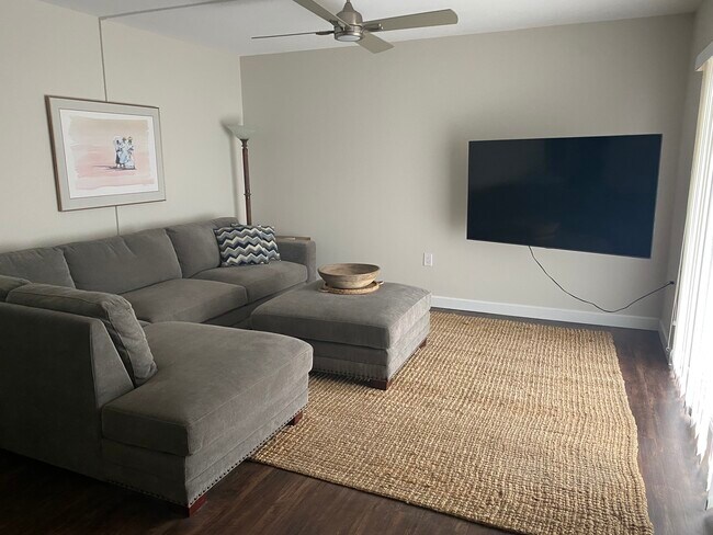 living room 75" tv - 409 Manatee Ct