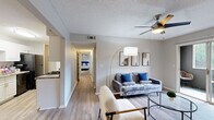 Located at 1747 Capital Circle NE in Tallahassee, FL, this single-story, 3-bedroom, 2-bathroom home offers a well-organized layout designed for comfortable everyday living. The inviting living room features light wood-look flooring, a ceiling fan, and a sliding glass door that opens to a private outdoor patio, filling the space with natural light. Adjacent to the living area, the galley-style kitchen is outfitted with white cabinetry, granite-style countertops, black appliances including a gas range and refrigerator, and a pantry for additional storage. A dedicated office with carpeted flooring and a window provides a quiet, functional workspace. The generously sized primary bedroom features plush carpet, a closet, and a ceiling fan, while two additional bedrooms offer comfortable accommodations with closet access. Both bathrooms include vanities with granite-style countertops and tub-shower combinations. The home also includes a hallway connecting the bedrooms, a welcoming entrance, and multiple closets throughout for ample storage. Neutral tones and consistent finishes create a cohesive, move-in-ready atmosphere throughout the entire home.