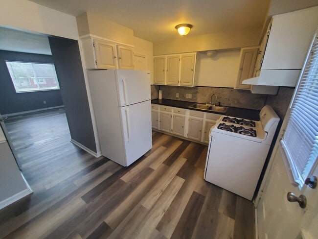 Full kitchen with half bath behind fridge - 5906 Christie Ave SE