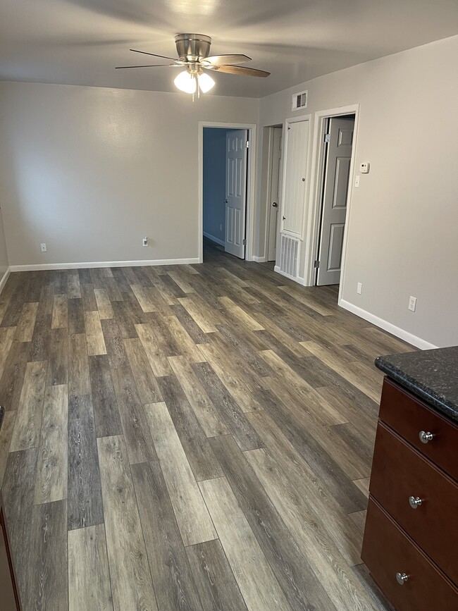 Kitchen looking at den with 2 bedroom doors and bath entry in the corner - 2525 Annunciation St