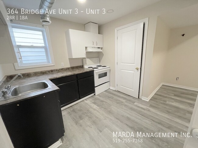 Building Photo - UPDATED 2-BEDROOM/1-BATH MAIN FLOOR UNIT-I...