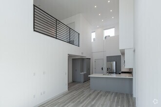2BR, 2BA - 1,232SF - B1 Loft - Living Room - Aurum