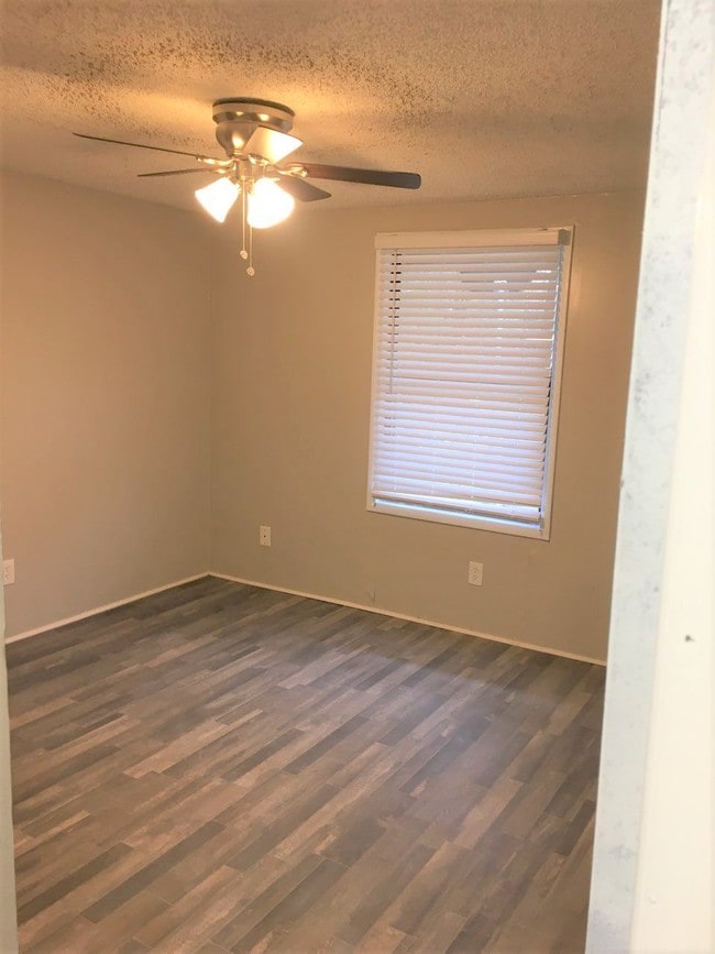 Bedroom in renovated unit. - Village at Iris Glen