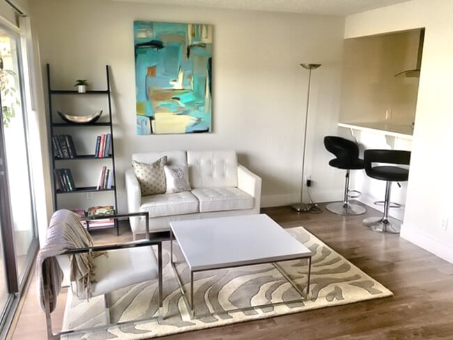 Spacious Living Space w/Contemporary Wood Flooring - Newport Apartments
