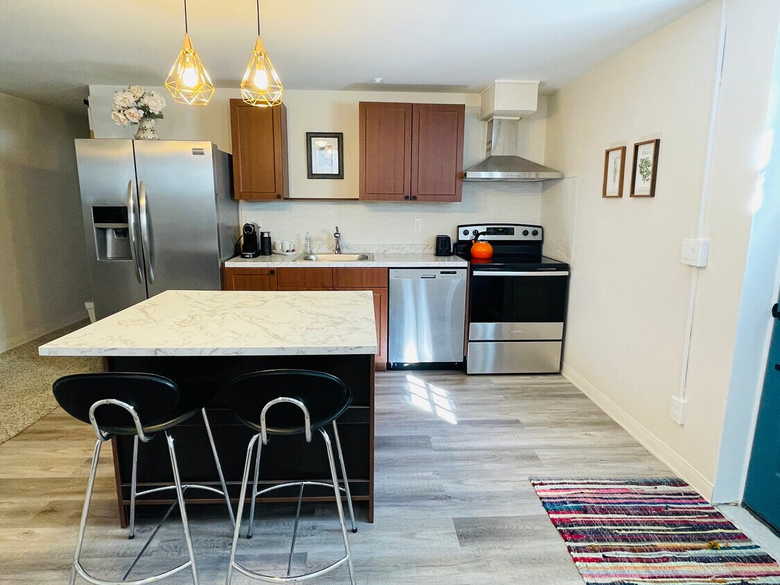 Kitchen with Island - 8931 W 7th Ave