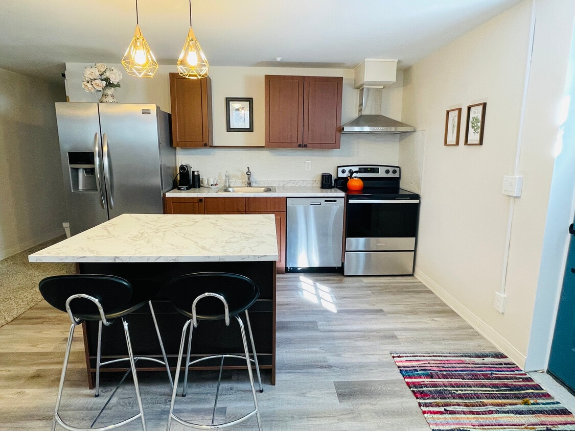 Kitchen with Island - 8931 W 7th Ave