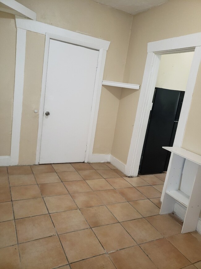 Living space with entrance to kitchen - 2110 W Flagler St