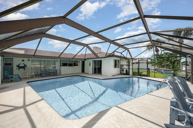 Building Photo - Enjoy the pool or fish/kayak/boat from the...