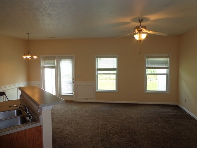 living room by "reqltygurusatl" - 2555 Flat Shoals Rd