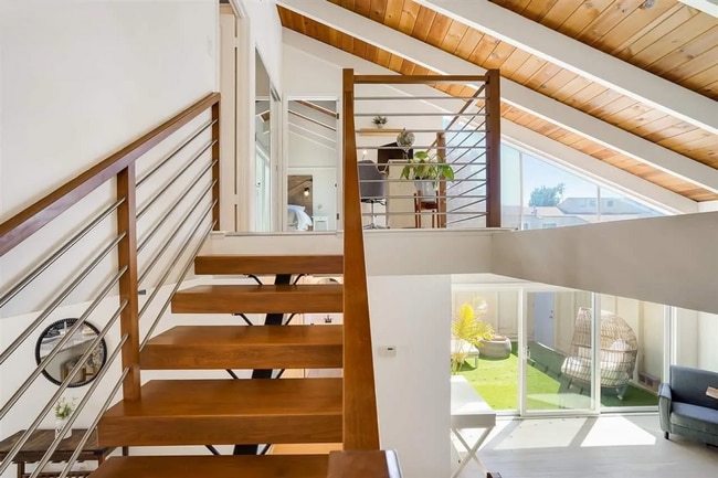 Building Photo - Spacious 1,550 Sq Ft Townhome | 2-Car Garage & High Ceilings w/ Exposed Beams