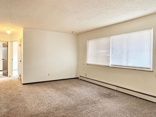 Building Photo - Great Two Bedroom, One Bath Apartments for Rent in East Loveland!  2 Weeks Free, Flexible lease t...