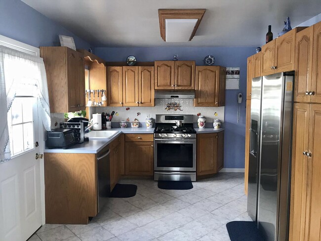 Kitchen with stainless steal appliances and a lot of storage! - 65 Tower Pl