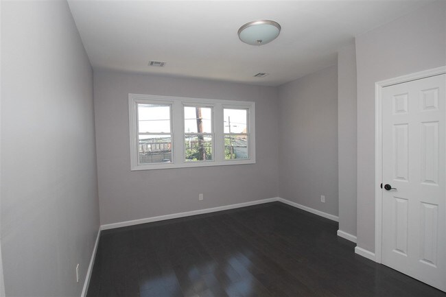 Building Photo - 143-145 Ave E