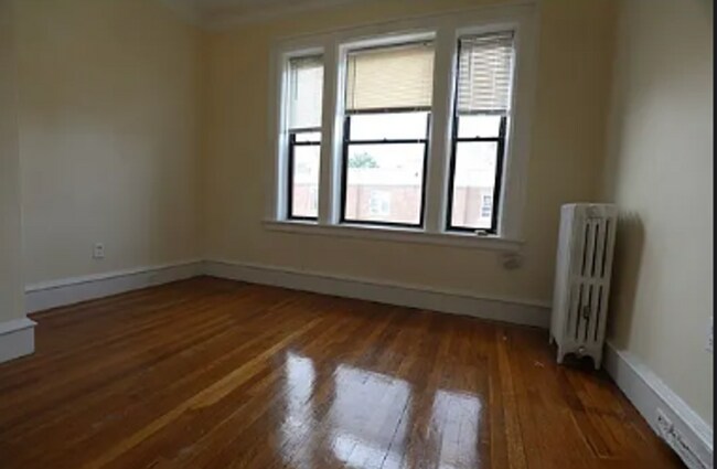 Building Photo - Watch YT Video Tour! Modern Apt w Ht/HW Included, Near T, NO FEE, Reduced Pricing! Spacious, Sunny!