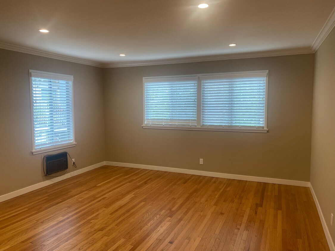 LIVING ROOM WITH CAN LIGHTING & REFINISHED HARDWOOD FLOORS - 3017 W Riverside Dr
