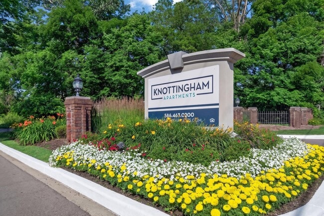 Welcoming entrance at Knottingham Apartments in Clinton Township, MI. - Knottingham Apartments