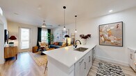 This well-designed one-bedroom, one-bathroom unit in Sherman, TX offers a thoughtful single-floor layout that maximizes every square foot. The welcoming entrance hallway, finished in crisp white with light wood-style flooring, flows naturally into the heart of the home. The open-concept kitchen and living area serves as the central gathering space, anchored by a generous kitchen island with a quartz countertop, undermount sink, and seating for multiple guests. Pendant lighting illuminates the island, while white shaker-style cabinetry, a full suite of stainless steel appliances, and a dedicated pantry complete the kitchen. The living area benefits from natural light streaming through large windows and a glass door, which opens to a private balcony. A ceiling fan overhead adds comfort to the space. The bedroom is a serene retreat, featuring a ceiling fan, a large window with ample natural light, and a closet with double doors for storage. The bathroom features a tiled tub-shower combination, a white vanity with storage, and clean, modern finishes. Additional conveniences include a dedicated laundry area, utility room, and an entrance closet, rounding out this efficiently planned and stylishly finished home.